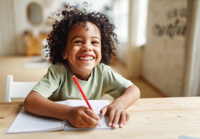 happy boy learning at home