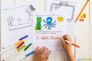 color the cute picture of an octopus, seaweed, and puffer fish and complete the free printable national aquarium month writing prompts for kids