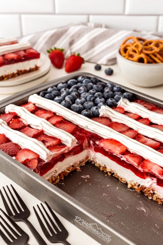 This yummy strawberry pretzel salad recipe is a delightuflly sweet and salty jello salad perfect for serving with hamburgers and more!